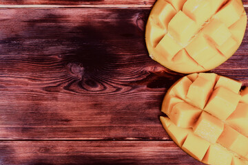 ripe mango on dark wooden background