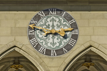 coat of arms and clock on the facade of the Town hall of Bern, Switzerland