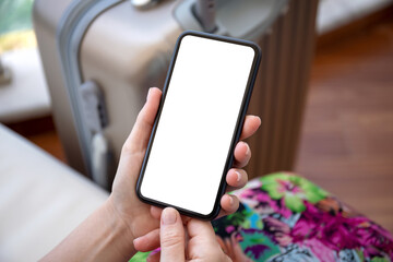 woman hands holding phone with isolated screen suitcase airport lounge