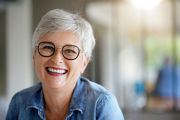 portrait of a beautiful smiling 55 year old woman with white hair - 383440275