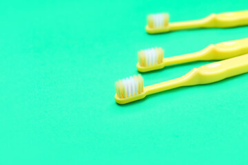 Tooth brushes on color background
