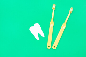 Tooth brushes on color background