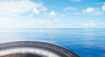 Compass on ship boat blue summer sea ocean day with bright sky. Marine cruise background banner.Shipping industry concept.