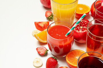 Concept of glasses with different juices on white background