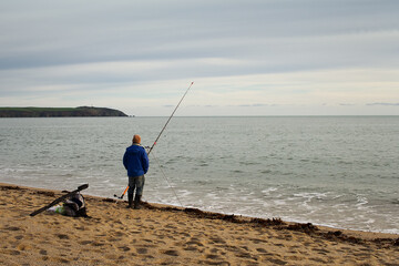 Fisherman On The Beach