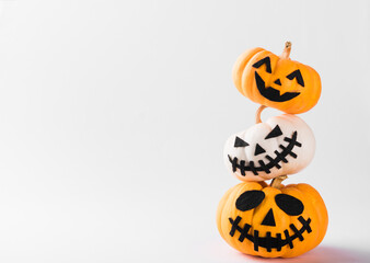 Funny Halloween day party concept ghost pumpkin head jack lantern scary smile and stack together, studio shot isolated on white background, Holiday decoration