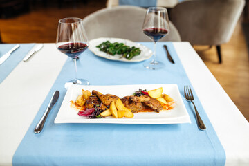 Roasted chicken and padron peppers with red wine