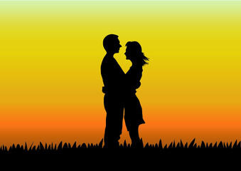 Expressing the love of two people who love each other on the grass with the golden sky at sunset.