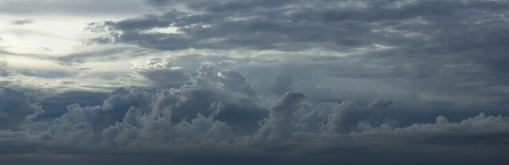 Beautiful landscape sky with warm contrast and white fluffy clouds. Nature background. Panoramic view