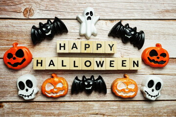 Happy Halloween alphabet letters top view on wooden background