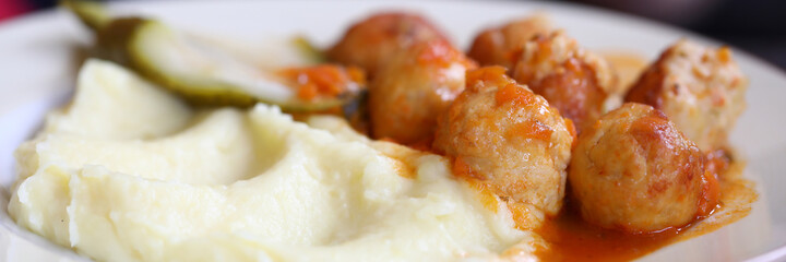 On dinner plate, mitbola mashed potatoes and pickled cucumber. Menu for cafes and restaurants concept