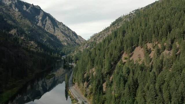 Breathtaking Tumwater Canyon Aerial with Glass Water Reflection of Beautiful Mountains