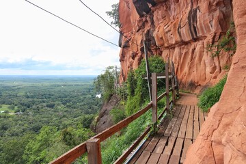 Wooden walkway on sandstone mountains at Phu thok temple Sri Wilai district Bueng Kan, Thailand.