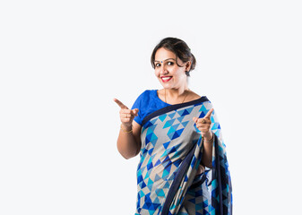 Indian asian pretty woman in saree presenting blank space