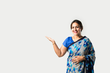 Indian asian pretty woman in saree presenting blank space