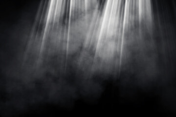 Abstract image of Studio dark room with spot lighting and fog or mist on in background. 