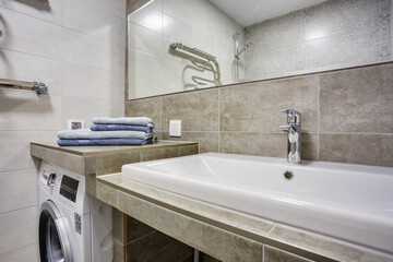 Ceramic Water tap sink with faucet with soap and shampoo dispensers in expensive loft bathroom or kitchen