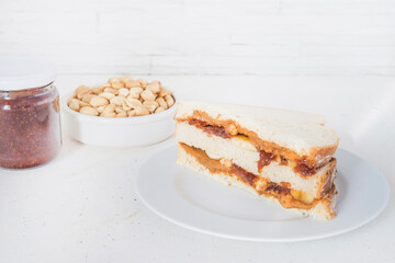peanut butter sandwich with banana and raspberry jam