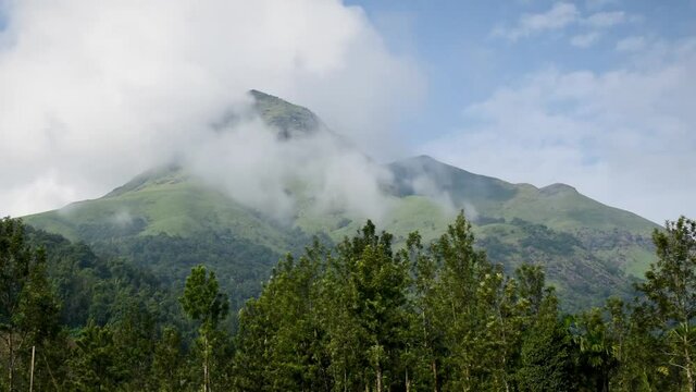 Panoramic view of Chembra peak , highest mountain in wayanad and one of the highest in the western ghats situated in meppadi, kerala .Time lapse video of moving clouds in the background.Hyper lapse.