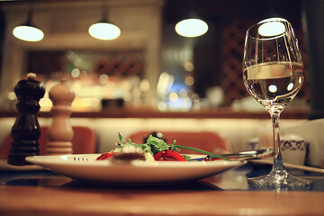 glass white wine restaurant interior, abstract evening dinner with alcohol at the bar
