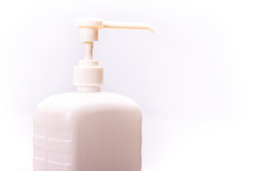 A white bottle of disinfectant on a white background