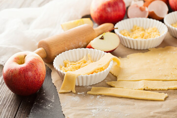 Cooking baking concept. Making rustic American style apple pie, view on table with ingredients.