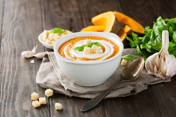 Vegetarian autumn pumpkin cream soup with seeds
