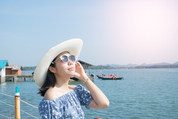woman in hat on the beach