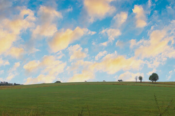 landscape with sky and clouds while sunset in autumn season in Europe.