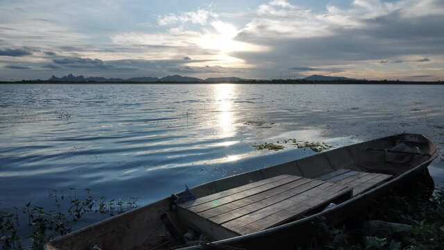 Nature background Rivers and Fishing boat during sunset