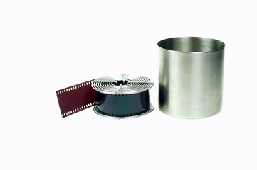 Close-Up a stainless reel with film loaded and the tank to preparing for develope processing.