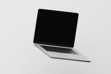 Fototapeta na wymiar flying laptop with blank screen - mockup