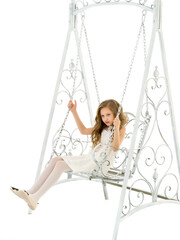 Blonde Girl in Nice Lace Dress Sitting on White Elegant Metal Swing.
