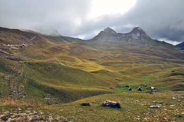 Fototapeta na wymiar Huts at Pastures of Piva Plateau in Durmitor National Park, Montenegro