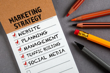 MARKETING STRATEGY. Website, Planning, Management and Social Media concept. To do list. Notepad with pencils