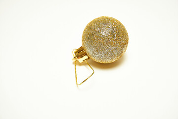 Golden Christmas ball on a white background, New Year, Christmas toys, holiday, Christmas.
