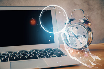 Desktop computer background in office and start up theme hologram drawing. Double exposure. Startup...