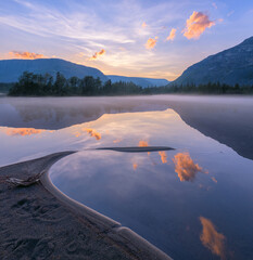 Mountain lake at dawn North of Russia. - 383471077