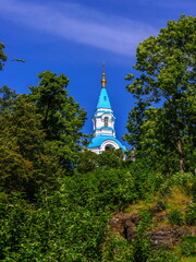 Fototapeta na wymiar View through the trees to the Valaam Transfiguration Cathedral.