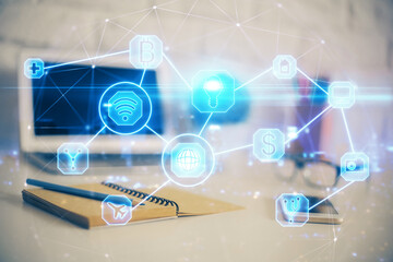 Computer on desktop with social network hologram. Multi exposure. Concept of international people connections.