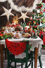 Christmas pastries on festive table in rustic style