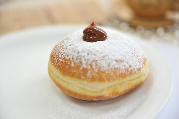 Hanukkah symbol jewish food holiday image of donut with caramel, sugar powder and cup cafe.