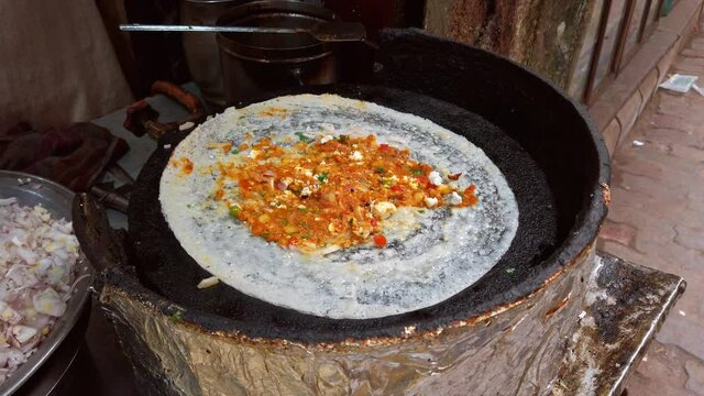 Varanasi, India. Cooking of traditional indian dish Masala Dosa.