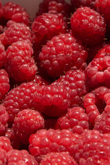 Fresh juicy ripe raspberry fruit, close-up, background.