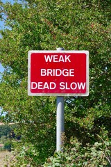 weak bridge warning sign