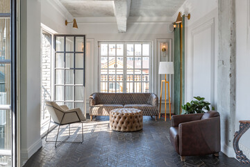 Chic, luxurious guest room design with old-fashioned antique furniture. white walls are decorated...