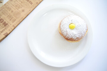 Hanukkah symbol jewish food holiday image of donut with egg jelly and sugar powder.