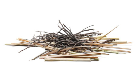 Dry twigs and straw pile isolated on white background