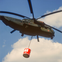 Ascent of a medium transport helicopter with firefighting water tank