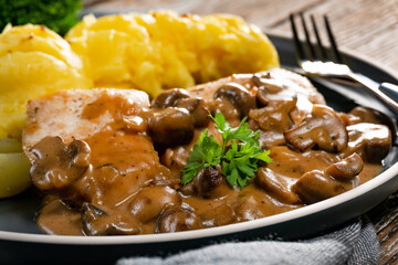 Grilled chicken breast with mushroom sauce.